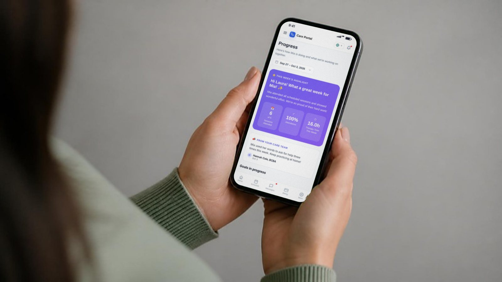 A parent checking her child’s progress in the Ezi Care Portal on her phone